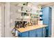 Home coffee bar with blue cabinets, wood countertop, floating shelves, and coffee machines at 17 Cross Creek Pkwy, Dallas, GA 30157