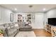 Cozy living room featuring a large sectional, built-in bookshelves, and stylish decor at 17 Cross Creek Pkwy, Dallas, GA 30157