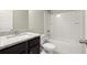 Bathroom with a granite countertop, a sink, and a tub with a shower at 2628 Wild Laurel Ct, Norcross, GA 30071