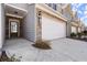 Close-up of a townhouse entrance showcasing stone accents and a well-maintained lawn at 2628 Wild Laurel Ct, Norcross, GA 30071