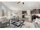 Open-concept living room flowing into the kitchen, with modern furnishings and natural light at 2628 Wild Laurel Ct, Norcross, GA 30071