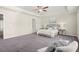 Large bedroom with a tray ceiling and plush carpet at 2628 Wild Laurel Ct, Norcross, GA 30071