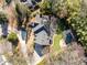 Aerial shot of the property highlighting the pool, backyard, pergola, and driveway, surrounded by greenery at 4399 Jett Nw Pl, Atlanta, GA 30327