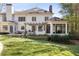 Expansive backyard with a pergola, outdoor kitchen, screened porch, and well-manicured lawn at 4399 Jett Nw Pl, Atlanta, GA 30327