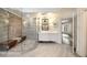 Luxurious bathroom with tiled shower, stone accents, and double vanity at 4399 Jett Nw Pl, Atlanta, GA 30327