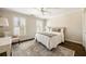 Cozy bedroom featuring a patterned rug and shuttered windows for great natural light at 4399 Jett Nw Pl, Atlanta, GA 30327