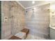 Tiled shower with built-in bench and stone accents at 4399 Jett Nw Pl, Atlanta, GA 30327