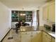 Bright dining area with built-in shelving, stylish light fixture and granite counter at 901 Guys Sw Ct, Lilburn, GA 30047