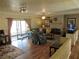 Spacious living room with hardwood floors, fireplace, and access to the patio at 901 Guys Sw Ct, Lilburn, GA 30047