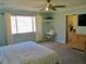 Bright bedroom with a vanity, ceiling fan, and large window, creating a comfortable retreat at 901 Guys Sw Ct, Lilburn, GA 30047