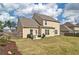 Large backyard with a patio, privacy fence, and well-maintained lawn at 39 Clubhouse Way, Acworth, GA 30101