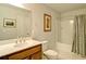 Bathroom featuring a wood vanity, tub, shower, and neutral colored tile at 39 Clubhouse Way, Acworth, GA 30101