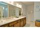 Bright bathroom features double sink vanity with marble countertop, shower and decorative wall art at 39 Clubhouse Way, Acworth, GA 30101