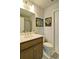 Well-lit bathroom with a white vanity, toilet, and artwork on the wall at 39 Clubhouse Way, Acworth, GA 30101