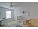 Bright bedroom with a desk, wicker chair, and window at 39 Clubhouse Way, Acworth, GA 30101