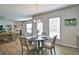 A dining area with round table, modern light fixture, and picture window at 39 Clubhouse Way, Acworth, GA 30101