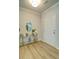 Bright foyer featuring wood floors, a console table with blue and white decor, and a white front door at 39 Clubhouse Way, Acworth, GA 30101