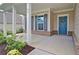 Welcoming front porch with white columns and a blue front door adorned with a decorative wreath at 39 Clubhouse Way, Acworth, GA 30101