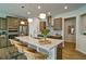 A kitchen island with stainless steel appliances, counter top and bar stool seating at 39 Clubhouse Way, Acworth, GA 30101
