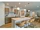 Spacious open kitchen with stainless steel appliances, a large island, and modern lighting at 39 Clubhouse Way, Acworth, GA 30101