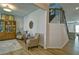 Open concept living room showcasing stairs, wooden floors, and elegant seating arrangements at 39 Clubhouse Way, Acworth, GA 30101
