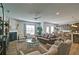Open-concept living area with wood floors, modern furniture, and a view into the kitchen area at 39 Clubhouse Way, Acworth, GA 30101
