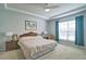 Bright bedroom with a tray ceiling, large window, and carpet floors at 39 Clubhouse Way, Acworth, GA 30101
