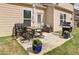 Inviting patio with outdoor furniture, potted plants, and a grill at 39 Clubhouse Way, Acworth, GA 30101