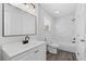 Bright bathroom with a modern vanity, toilet, and tiled shower/tub combination at 8744 Bellwood Ct, Riverdale, GA 30274