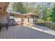 Wide back deck with outdoor seating and lush greenery at 1446 Lively Ridge Ne Rd, Atlanta, GA 30329