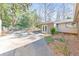 Rear view of the backyard with patio and landscaping at 1446 Lively Ridge Ne Rd, Atlanta, GA 30329