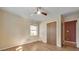 Bedroom with hardwood floors, ceiling fan, closet, and natural light at 1446 Lively Ridge Ne Rd, Atlanta, GA 30329