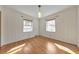 Bright bedroom with hardwood floors and two windows providing ample natural light into the room at 1446 Lively Ridge Ne Rd, Atlanta, GA 30329