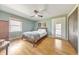 Well-lit bedroom features a ceiling fan, a window, closet, and door to the outside at 1446 Lively Ridge Ne Rd, Atlanta, GA 30329