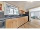 Kitchen with stainless steel appliances, wood cabinets, tile floors, and granite countertops at 1446 Lively Ridge Ne Rd, Atlanta, GA 30329