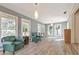 Bright living room featuring neutral walls, hardwood floors, and oversized windows showcasing the exterior landscape at 1446 Lively Ridge Ne Rd, Atlanta, GA 30329