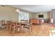 Sunlit open-concept living room featuring beautiful hardwood floors, a modern light fixture and neutral tones at 1446 Lively Ridge Ne Rd, Atlanta, GA 30329
