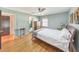 Cozy main bedroom with hardwood floors, a ceiling fan, and a peaceful ambiance at 1446 Lively Ridge Ne Rd, Atlanta, GA 30329