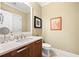 Well-lit bathroom with a sleek vanity and a large mirror at 3633 Broughton Se Cir, Atlanta, GA 30339