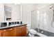 Bathroom features a glass shower, tiled walls, and modern vanity at 3633 Broughton Se Cir, Atlanta, GA 30339