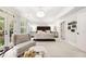 A spacious bedroom featuring French doors to a balcony, and a beautiful chandelier at 3633 Broughton Se Cir, Atlanta, GA 30339