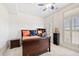 Bedroom with neutral carpet, plantation shutters and ceiling fan at 3633 Broughton Se Cir, Atlanta, GA 30339