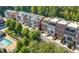 Overhead view of a townhouse community with pool, landscaping and garages at 3633 Broughton Se Cir, Atlanta, GA 30339