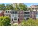 Charming brick townhomes feature beautiful architecture, balconies, and well-maintained landscaping at 3633 Broughton Se Cir, Atlanta, GA 30339