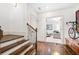 Hallway featuring hardwood floors, stairs, and entryway to the living room at 3633 Broughton Se Cir, Atlanta, GA 30339