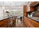 Modern kitchen with stainless steel appliances, granite countertops, and wood cabinets at 3633 Broughton Se Cir, Atlanta, GA 30339