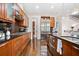 Well-lit kitchen with stainless appliances, wood cabinets, and a functional center island at 3633 Broughton Se Cir, Atlanta, GA 30339