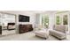 Spacious primary bedroom with large windows, seating area, and elegant chandelier at 3633 Broughton Se Cir, Atlanta, GA 30339