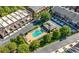 Aerial view of community pool, surrounded by lounge chairs and trees at 3633 Broughton Se Cir, Atlanta, GA 30339