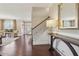 Bright foyer with hardwood floors, staircase, and view into the living room, creating a welcoming entrance at 4375 Maverick Nw Ln, Kennesaw, GA 30152